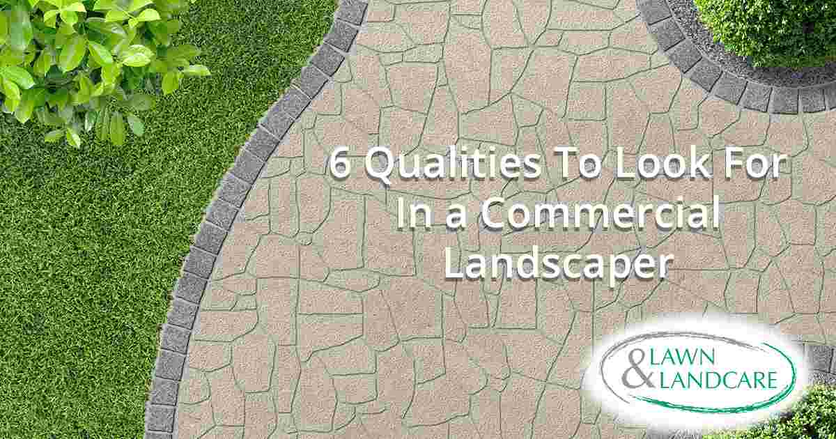 Commercial landscaper maintaining a professional property, showcasing Lawn & Landcare’s expertise and the key qualities to look for in a commercial landscaper.