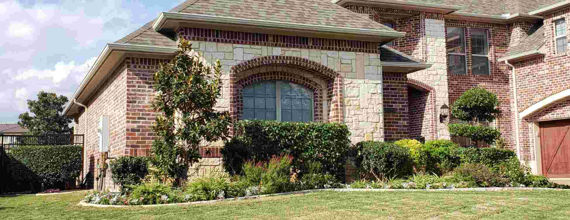 Landscape showcasing professional Lawn and Landscaping Services, highlighting expert lawn care, garden design, and outdoor maintenance to enhance curb appeal and create a well-maintained, vibrant outdoor space.